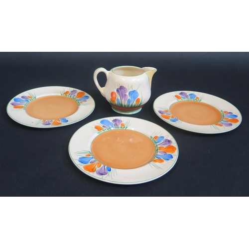 198 - A Clarice Cliff Spring Pattern Milk Jug and two tea plates