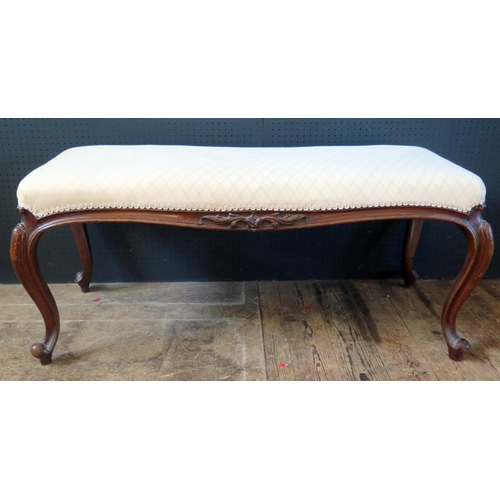 266e - A 19th Century French Overstuffed Stool with cabriole legs. 108cm w x 46cm d x 48cm h.