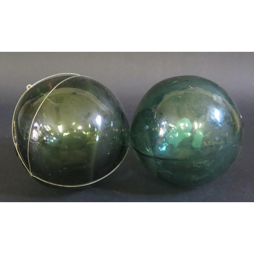 397 - A Pair of Green Glass Fishing Floats