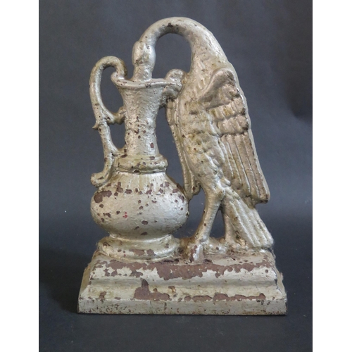 432 - Antique Cast Iron Door Stop in form of a Bird Drinking from a Ewer.  27.5cm tall.