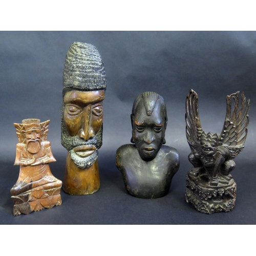 437 - Four Tribal Carved Wood Figures.  Tallest 34cm.