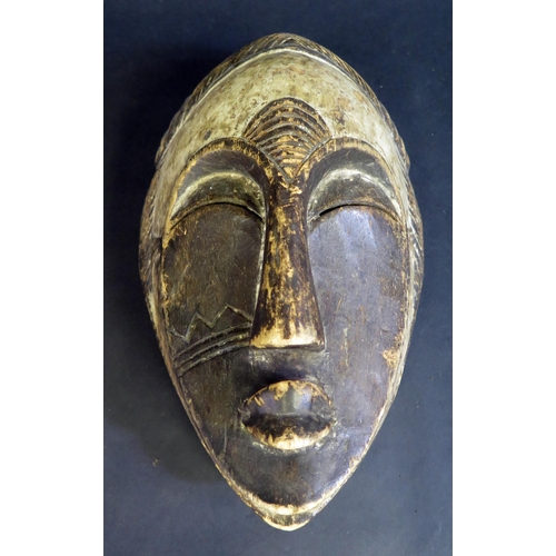 440 - A West African Gabon Carved and Painted Light Wood Spirit Mask, 31cm