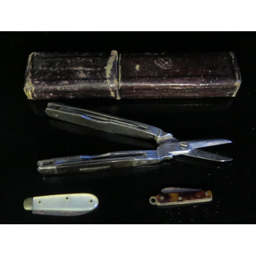 521 - A 19th Century Cased Three 'Blade' Scissor Knife 8cm (one blade missing) and two miniature penknives