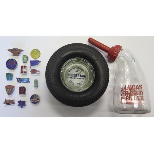 722 - A Lucas Battery Filler, Firestone tyre ashtray and enamel badges