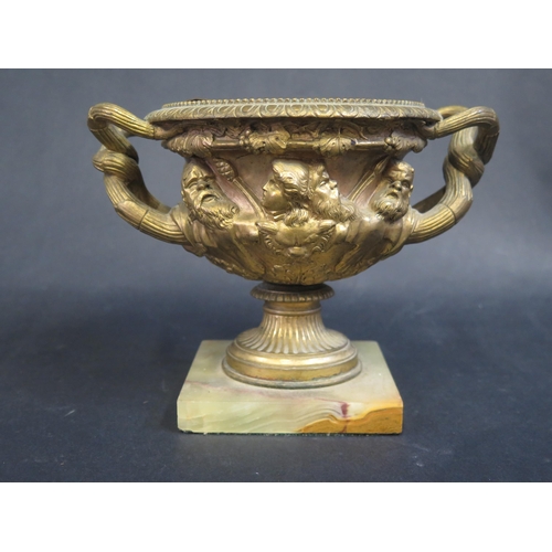 775 - A Gilt Brass 'Warwick Bowl' on onyx base, 15cm high