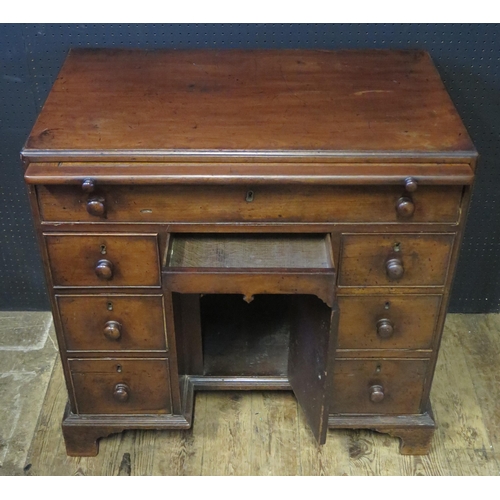 217 - A Georgian Mahogany Knee Hole Desk with oak brush slide and 'hidden' frieze drawer, 81cm w x 49cm d ... 