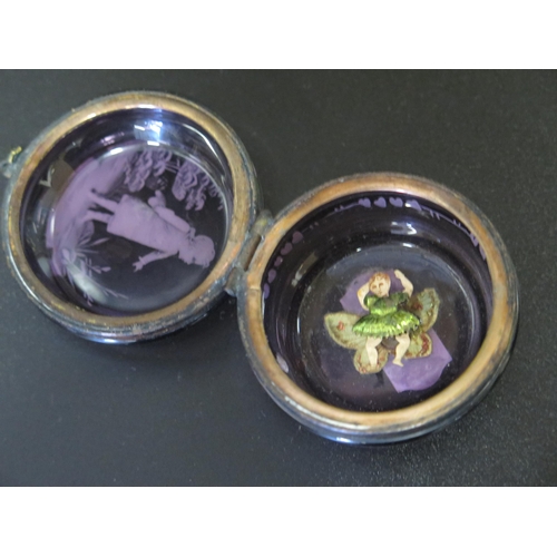 547 - A 19th Century Mary Gregory Amethyst Glass Hinged Box decorated in enamels opening to reveal a fairy... 