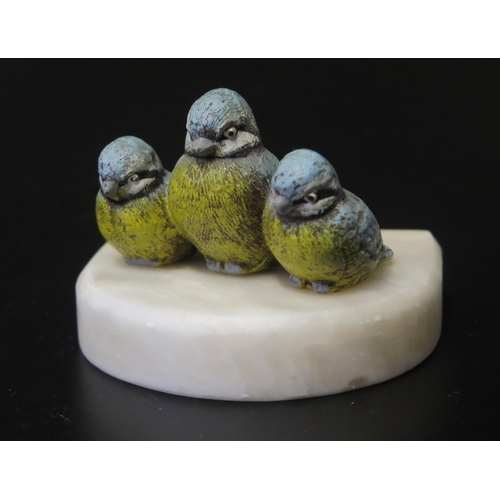 550 - A Cold Painted Bronze Group modelled as three blue tits on a soapstone base, 8wm wide