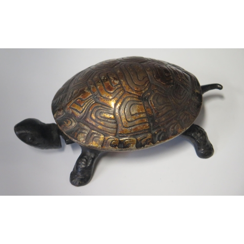 556 - A 19th century Cast Iron Tortoise Bell with clockwork movement operated by depressing head or tail, ... 