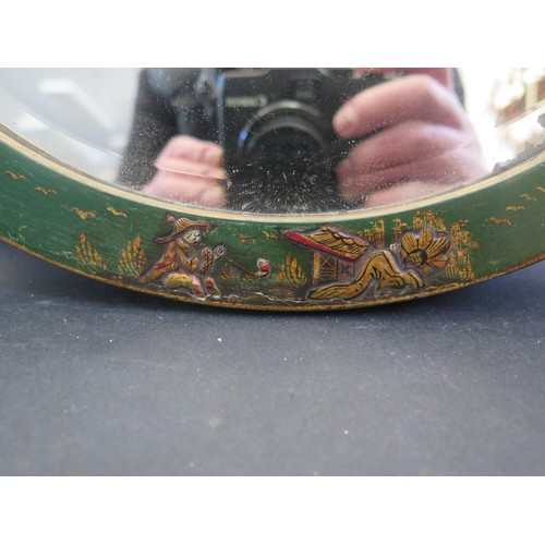 215A - A Green Japanned Chinoiserie Decorated Wooden Bevel Edge Oval Mirror. (29cm x 24cm)