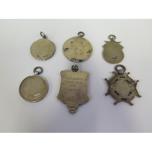 112 - A Collection of Silver and Enamel Motoring Fob Medallions and one plain silver including Sunbeam Mot... 