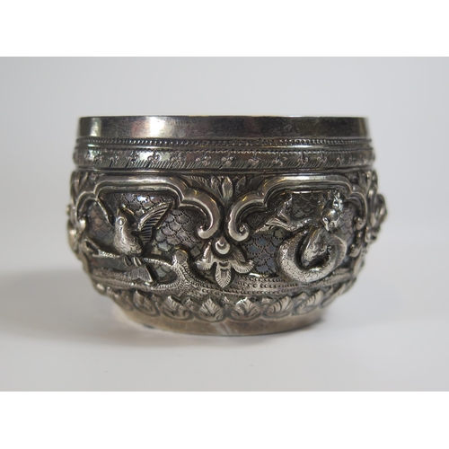 131 - A Pair of Indian Silver Bowls with embossed decoration, 7.5cm wide, 66g