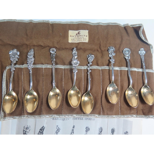 136 - A Set of Eight Sterling Silver Flower Handle Coffee Spoons with gilt bowls, Reed & Barton, 82g