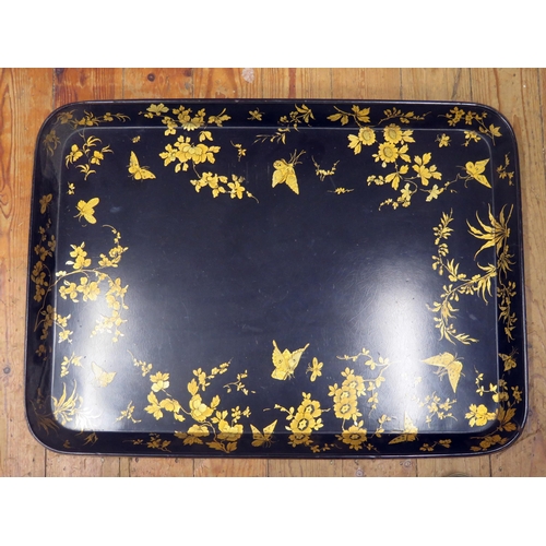 1431 - A Good and Large  Victorian Papier-mâché Tray, the black ground decorated in gilt with butterflies a... 