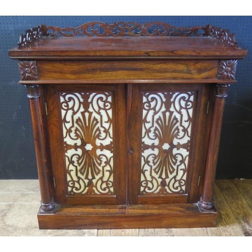 1886 - A Victorian Rosewood Cupboard with three quarter galleried top decorated with foliate scroll fretwor... 