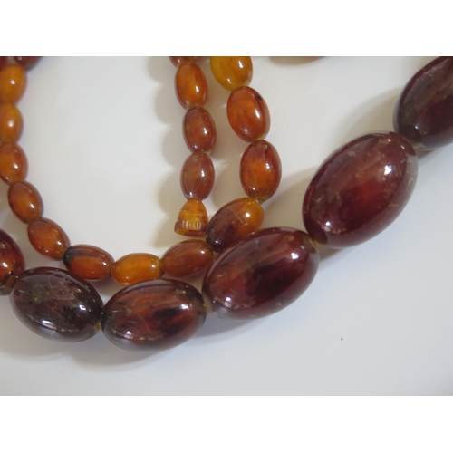 263 - A Faux Amber Graduated Bead Necklace, 108cm, largest bead 30x20mm, 85.2g