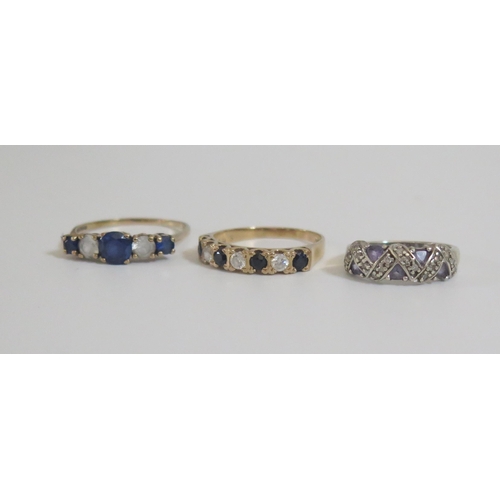 266 - A Large 9ct Gold Five Stone Ring (size U.5, 2.6g), 9ct gold sapphire and cz ring (sizeR.5, 2.7g) and... 