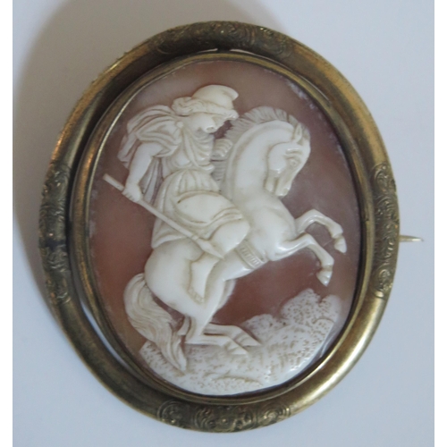 282 - A Victorian Swivel Shell Cameo Brooch decorated with a soldier on rearing stallion and with a glazed... 