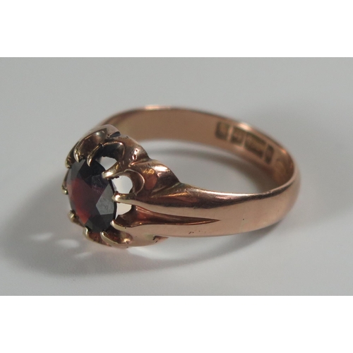 286 - A Gent's 9ct Gold and Garnet Ring, Birmingham W, 8mm diam. garnet, size X, 6.8g