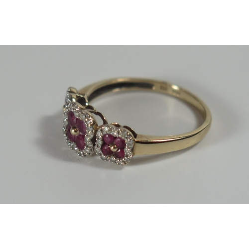 297 - A 9ct Gold, Ruby and Diamond Ring, 17x8mm head, size P.25, 2.3g