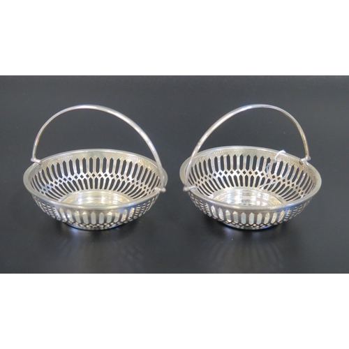 3 - A Pair of George VI Pierced Silver Swing Handled Bonbon Dishes, Birmingham 1938, Mappin & Webb, 90.7... 