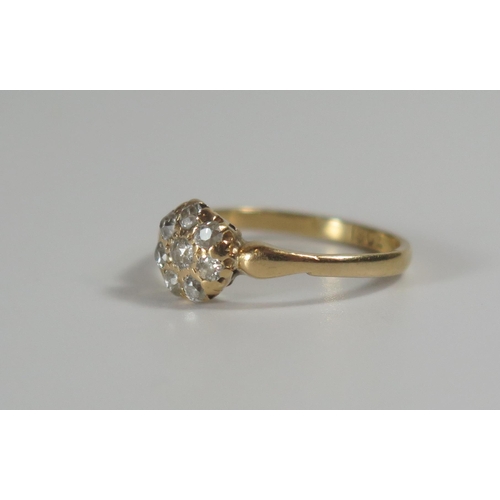 301 - An 18ct Gold and Diamond 'Daisy' Cluster Ring, 7.3mm dead, size I.75, 2g