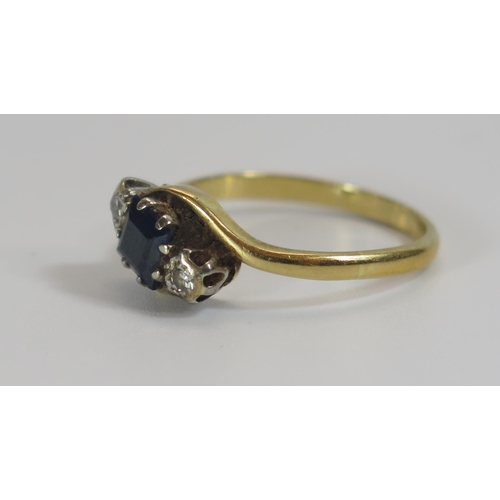 307 - An 18ct Gold, Sapphire and Diamond Three Stone Ring, 11.5mm setting, 4.8mm sapphire, size M.5, 2.8g