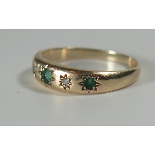 312 - A 9ct Gold, Emerald and Diamond Gypsy Ring, size O.5, 2.3g