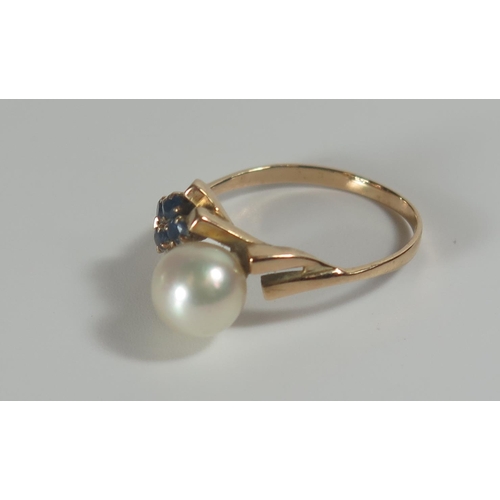 315 - A Five Stone Pearl and Sapphire Ring in an unmarked gold setting, 6.5mm pearl, size N.5, 2.5g