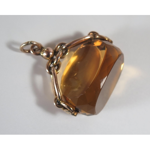 325 - A Large 9ct Gold and Citrine Spinning Fob, 37mm wide, 26.4g