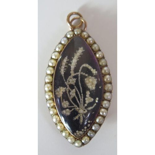 328 - A Pretty Cased Georgian Gold, Pearl and Seed Pearl  Memorial Pendant / Brooch decorated with a folia... 