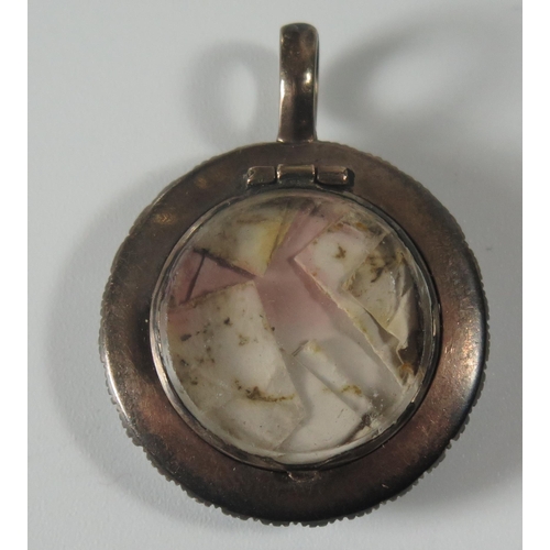 365 - An Antique Pearl Mounted Memorial Locket with hinged panel, 26mm diam.