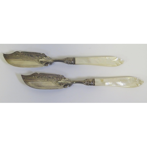 38 - A Cased Pair of Victorian Silver and Mother of Pearl Butter Knives with chased foliate decoration, B... 