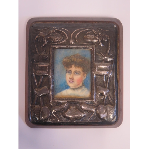 49 - An Arts & Crafts Silver Frame with hand painted miniature of a lady, 11.5x10.5cm