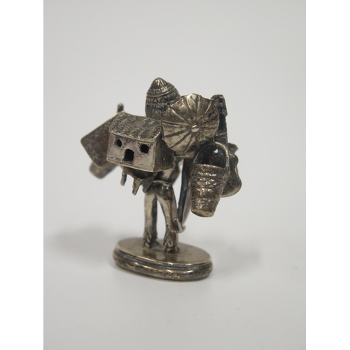 69 - A White Metal Street Hawker, c. 6cm, 80.7g