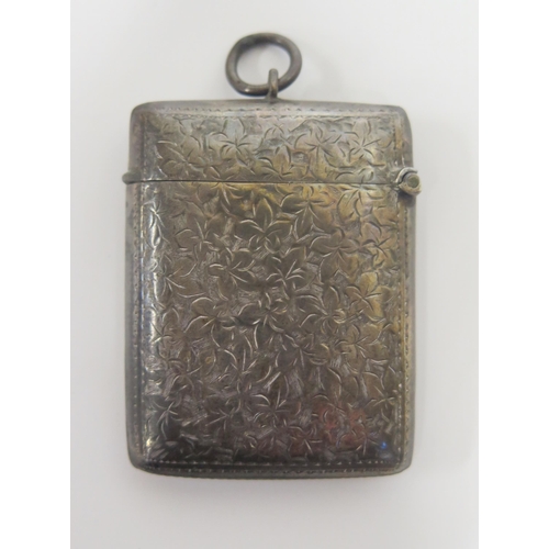 74 - A Victorian Silver Vesta Cased with chased ivy leaf decoration and contemporary monogram, Birmingham... 