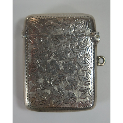 74a - An Edward VII Silver Vesta with chased foliate decoration, 50x37.7mm, Sheffield 1903, Walker & Hall,... 