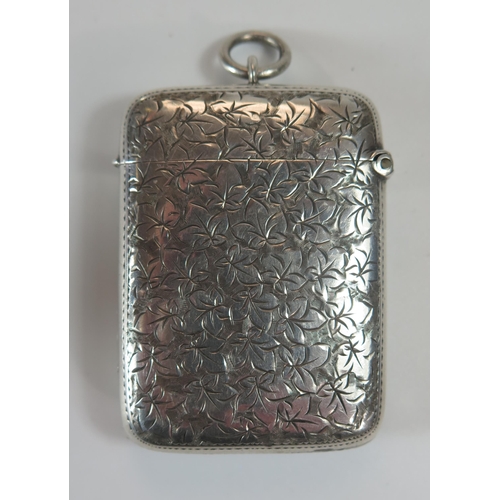 74b - A Victorian Silver Vesta with chased foliate decoration and period engraved inscription, 56x41mm, Bi... 