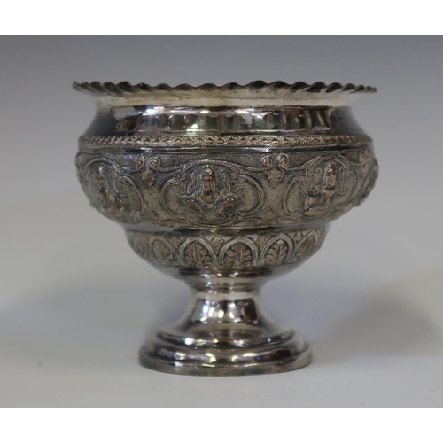 104 - An Indian Silver Stemmed Bowl embossed with Hindu figures, 12 cm diam. x 10.5 cm high, 169.1 g