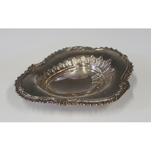 111 - A Victorian Silver Shaped Dish with embossed decoration and standing on three swept legs, London 189... 