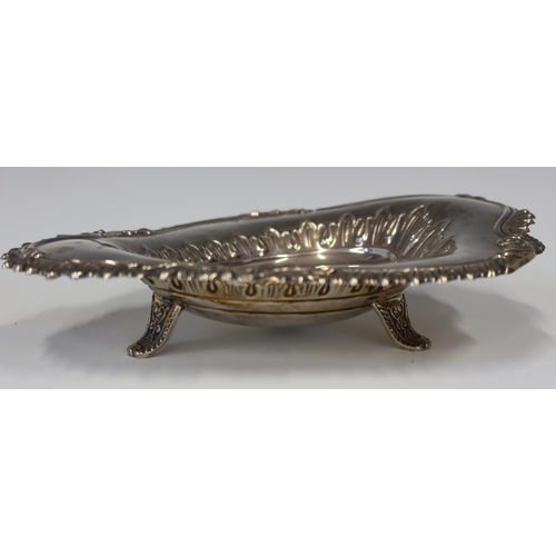 111 - A Victorian Silver Shaped Dish with embossed decoration and standing on three swept legs, London 189... 