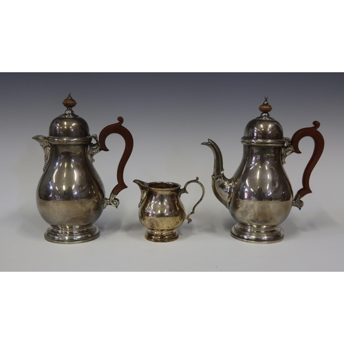 112 - A George VI Silver Bachelor's Coffee Pot, Hot Water Pot and Creamer, Birmingham 1947, Adie Bros., 19... 