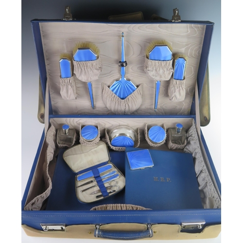 117 - A Superb George V Silver and Blue Guilloché Enamel Travelling Toiletry Set including a six part mirr... 