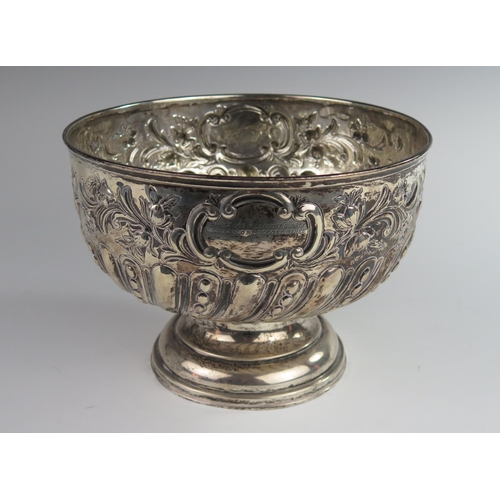 121 - An Edward VII Silver Presentation Punch Bowl with embossed foliate decoration, Birmingham 1909, FB &... 