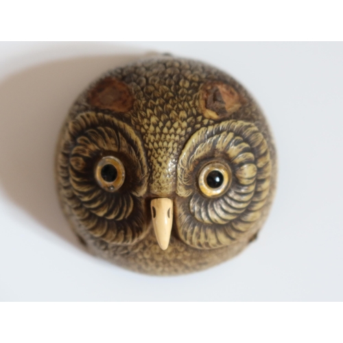 131 - A Rare Antique Owls Head Clock Bell Push, modelled in plastic with glass eyes on a metal base, 9.5cm... 