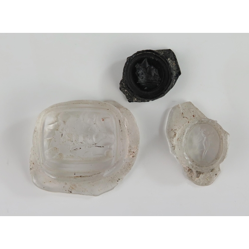 149 - Three Antique Glass Cameos, one decorated with a lion, one with a full length classical figure and o... 