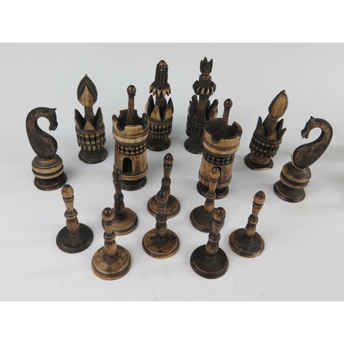 167 - A 19th Century Indian Carved and Stained Bone Chess Set, kings 98 mm, pawns 58 mm