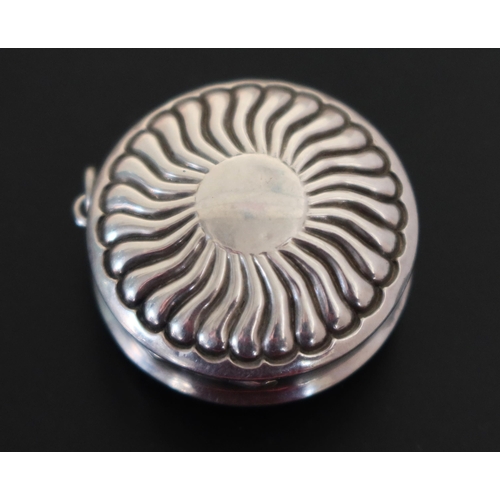 18 - A Victorian Silver Circular Vinaigrette with wavy gadrooned embossed decoration and foliate chased g... 