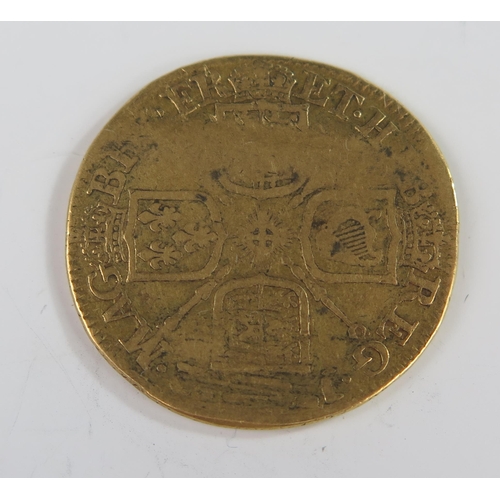 198 - United Kingdom Queen Anne (3rd bust) Gold Guinea, 25mm. Poor, KM# 534, Sp# 3574. Possibly ex- love t... 