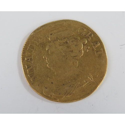 198 - United Kingdom Queen Anne (3rd bust) Gold Guinea, 25mm. Poor, KM# 534, Sp# 3574. Possibly ex- love t... 